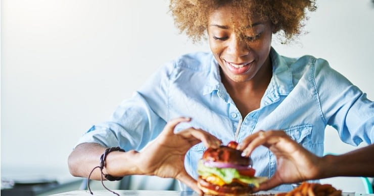 Woman About To Eat Burger Feature Fb